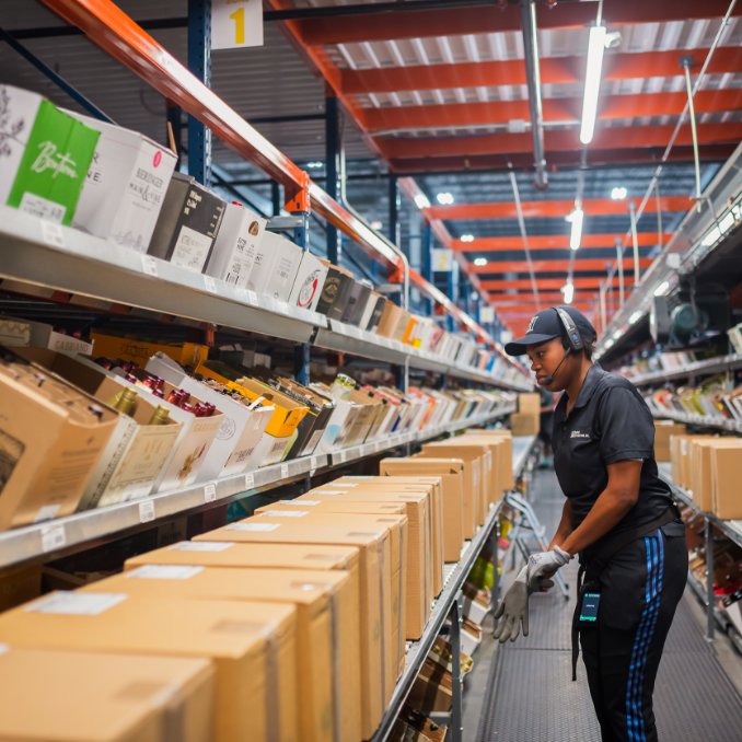 Employee working hard in the liquor warehouse