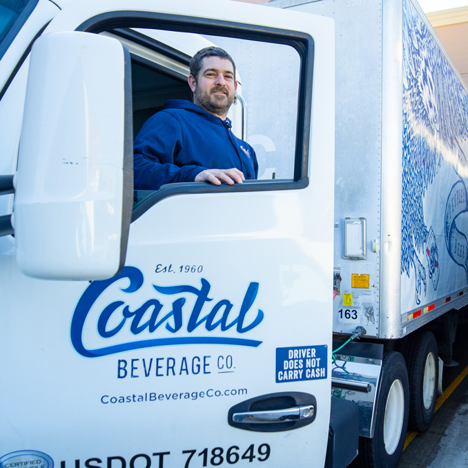 beer-wine-distributor Coastal Beverage Co. Truck with Employee smiling in the window