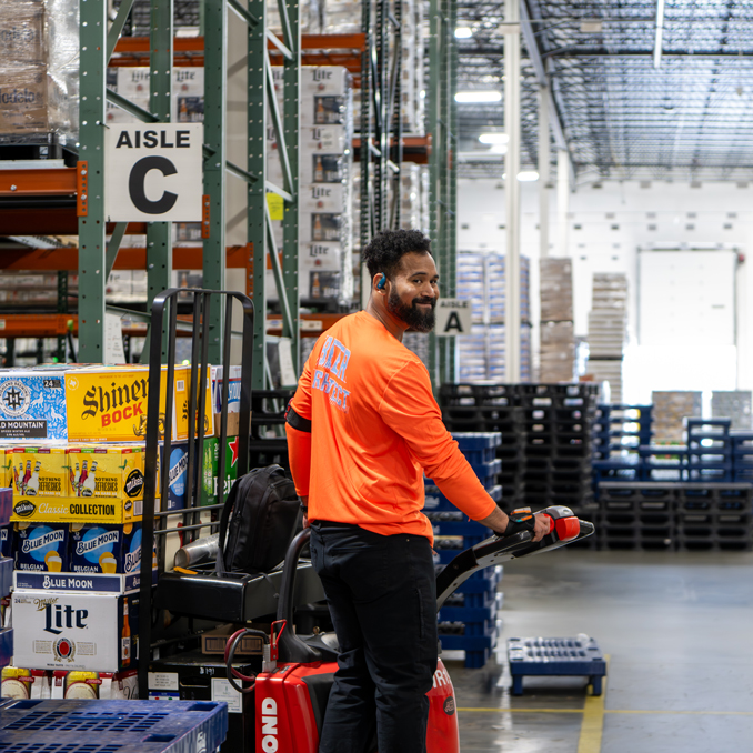 Smiling in the beer warehouse
