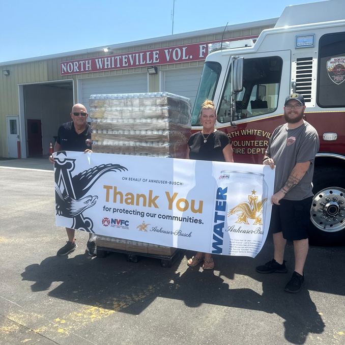 North-Whiteville-VFD-6.11.26 North Whiteville VFD employees holding a Thank You Banner